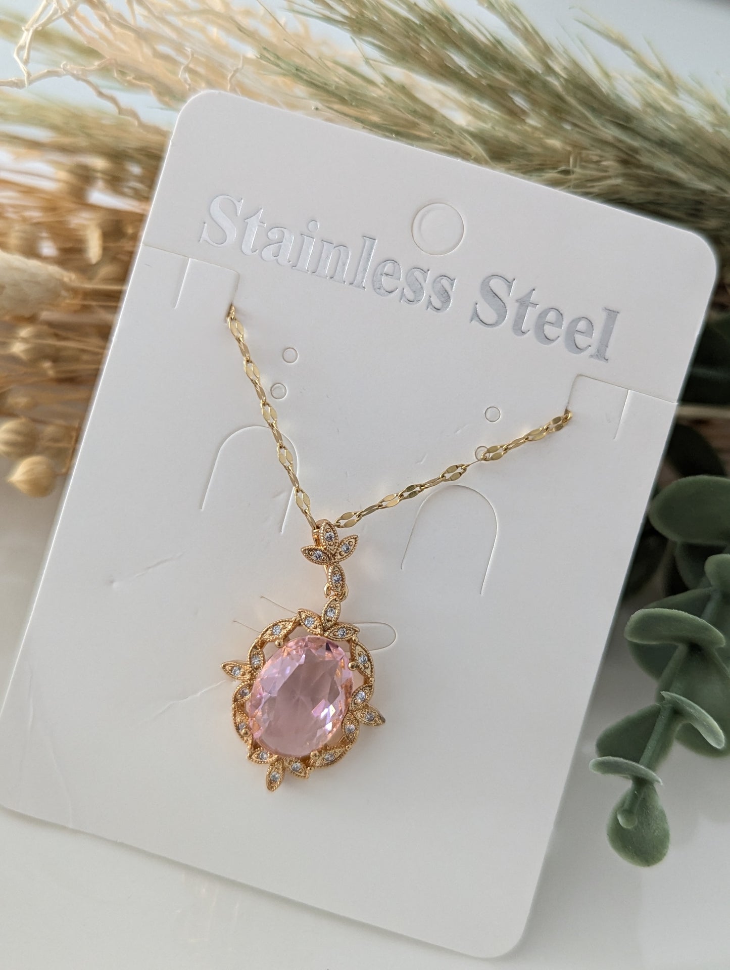 Copper plated fashionable pink oval charms. S. Steel Necklace